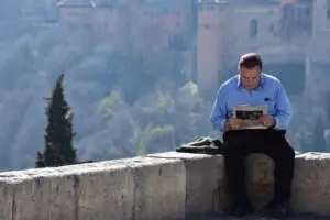 Reading the newspaper in the street
